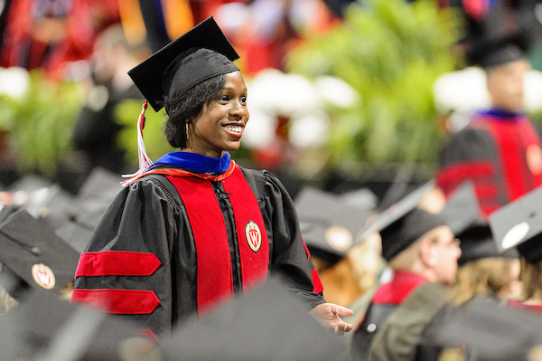 Catasha Davis, who holds an M.A. and Ph.D. in Journalism, among other advanced degrees, at a UW–Madison commencement ceremony.