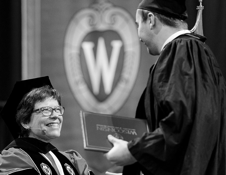 Graduate receiving a diploma from the chancellor