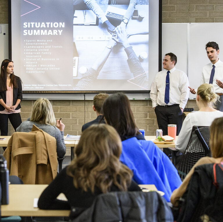 Students in a Digital Media Strategies class taught by Debra Pierce, faculty associate in the School of Journalism and Mass Communication at the University of Wisconsin-Madison, make presentations on their solutions to real-world business communication problems to a panel.