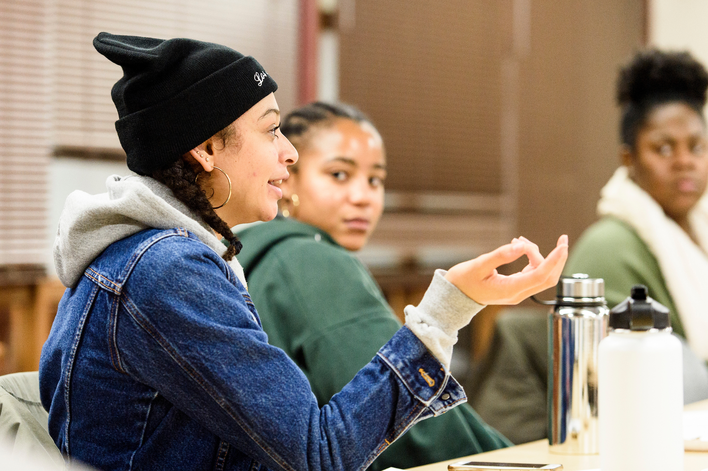 Students from The Black Voice discussing a multimedia project