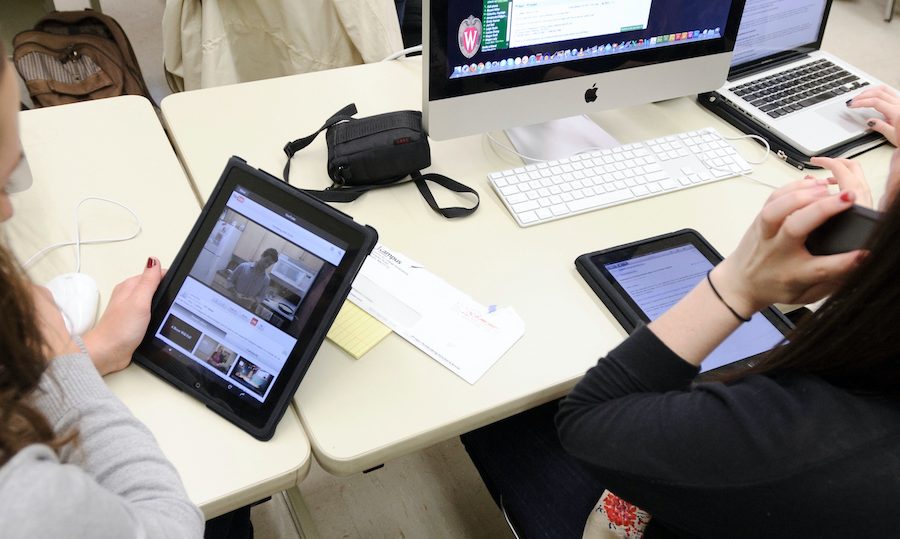 Students using iPads, laptops and desktop computers
