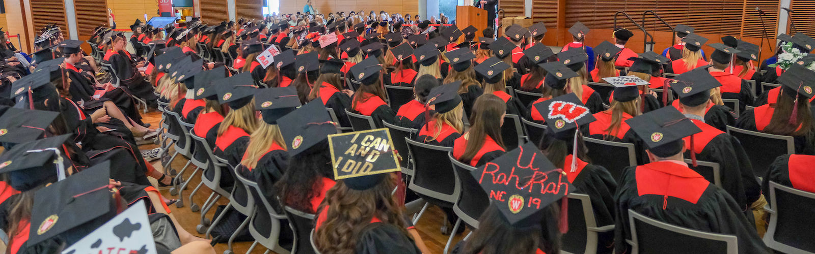 students in caps and gowns at a commencement celebration