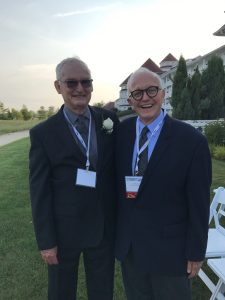 Jack Mitchell and Jim Hoyt stand together outside the Blue Harbor Resort in Shebooygan, WI