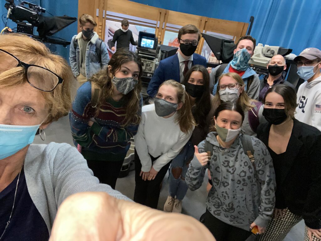 Students in J425 and instructor Pat Hastings pose for a selfie in the WPTV studios