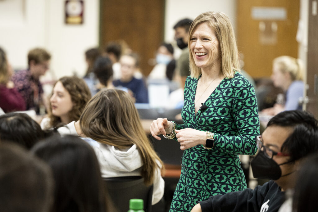 Stacy Forster standing among students as she teaches Journalism 202.