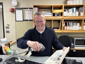 Andrew McDonnell scanning a magazine out of the library