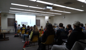 Students watch presentations by fellow classmates in Matt Hermann’s sports marketing communication course.