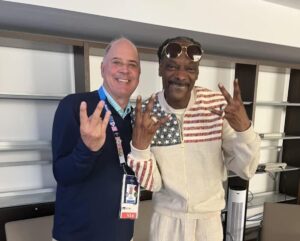 Greg Hughes poses with Snoop Dog at the 2024 Olympic Games in Paris.