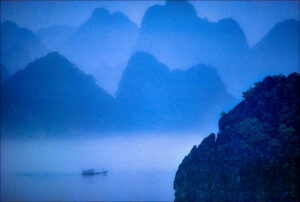 A sampan sails Hạ Long Bay, Vietnam