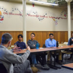 Adam Schrager teaches storytelling skills to 4 UW-Madison Posse scholars.