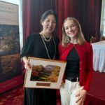 Professor Young Mie Kim and SJMC student Kate Lewicki with Young Mie Kim's Phi Beta Kappa Teaching Excellence Award plaque.