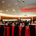Graduates sing "Varsity" at the end of the 2025 SJMC Spring Graduation Celebration.