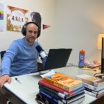 Elohim Monard recording his podcast in his office